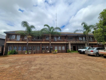 Large office block with warehouse on the main road